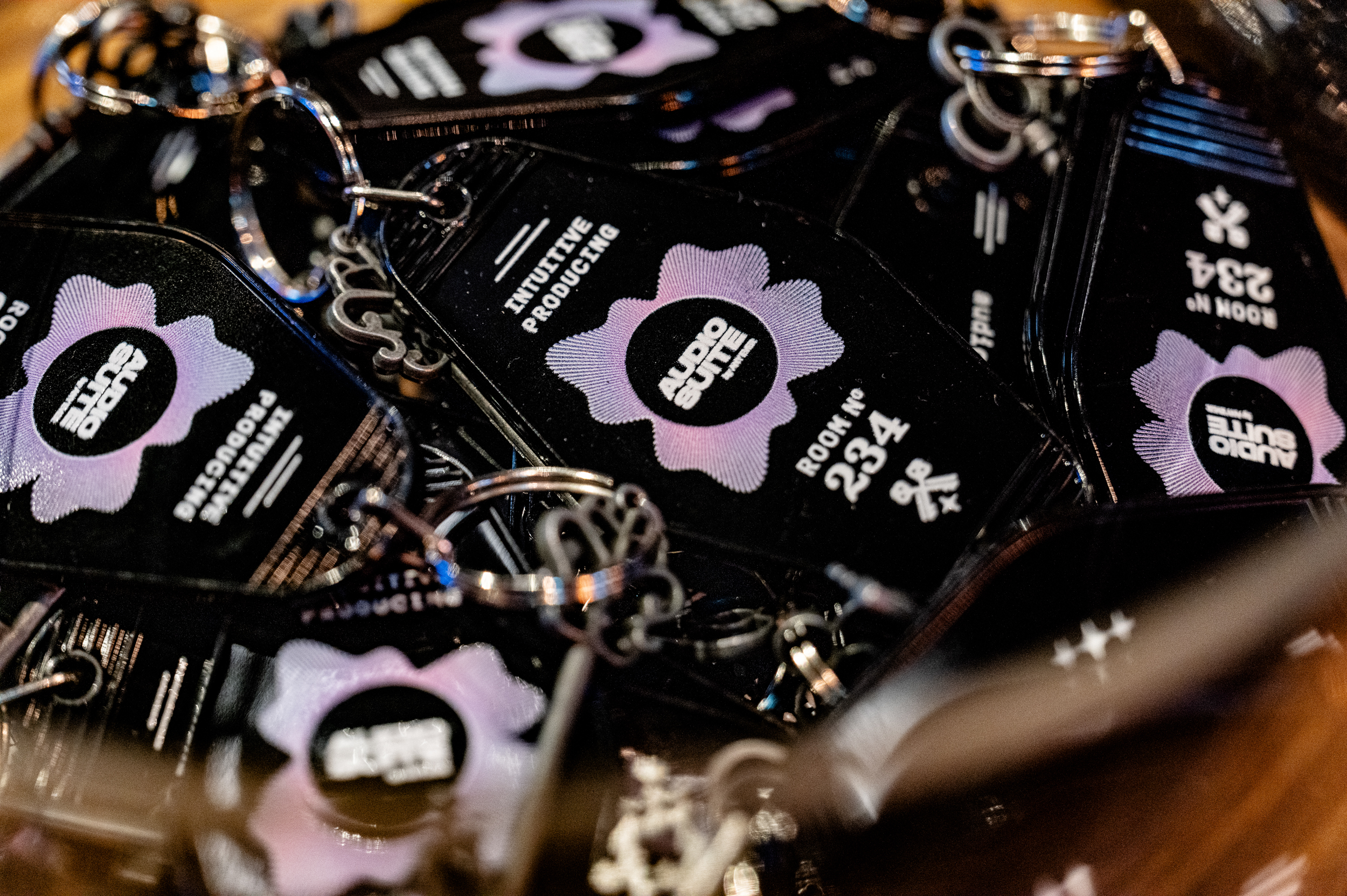 Close-up of black packaging with a purple gear-shaped logo and white text labels visible in the center.